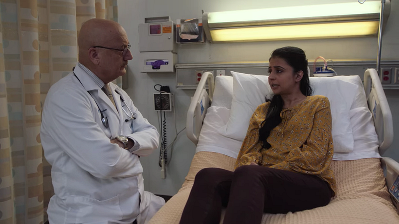 Dr. Kapoor talking with a patient on the TV series New Amsterdam